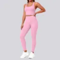 Detailed view of the pink seamless activewear set featuring a crop top and high waist leggings. - Sakura Pink