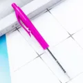 Retractable ballpoint pen with bright pink body and transparent lower barrel showing refill. - Deep purple