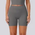 Gray high-waist yoga shorts detail, stretchy breathable activewear fabric for fitness training. - S / Titanium Gray