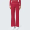 Red high-waist flared yoga pants with white piping detail, perfect for fitness and casual wear. - Cherry Red