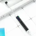 Multi-color creative ballpoint pen with retractable pointer design, black starry pattern body. - Black