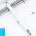 White blank sublimation retractable ballpoint pen, perfect for custom DIY gifts and business promos. - 1.0mm Bullet Tip / White