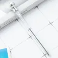 Silver crystal crown ballpoint pen with sparkling stones and elegant twist mechanism for writing. - Silver
