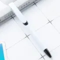 White plastic retractable ballpoint pen with black clip ring for office and school stationery use - White Barrel - Black