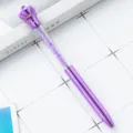 Purple crown crystal ballpoint pen variant, featuring sparkling rhinestones in a clear barrel. - Purple