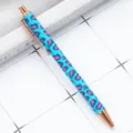Retractable ballpoint pen with blue pink leopard print design and rose gold metal trim. - Small Leopard Blue