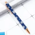 Blue retractable ballpoint pen with elegant white snowflake pattern and rose gold trim. - Christmas Blue Style 4