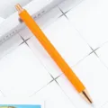 Orange glitter retractable ballpoint pen with rose gold metal trim for office use. - Painted Orange
