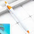 Plastic click ballpoint pen with slim white barrel and bright orange clip for daily office. - Orange