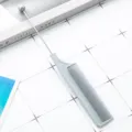 Grey plastic pin tail comb with metal needle and bead tip, professional hair styling tool. - Gray