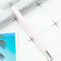 Minimalist light pink retractable ballpoint pen with metallic accents for office and school. - Light Pink (Silver Hardware)