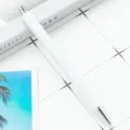 Minimalist white click ballpoint pen with metal trim, smooth writing for office and school. - White with Silver Parts