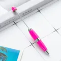 DIY beadable ballpoint pen with pink candy-colored metal body and rotating mechanism for crafts. - Rose Red