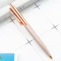 Elegante rosé gouden metalen balpen met klikmechanisme voor soepel schrijven op kantoor. - Roségoud