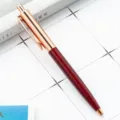 Intrekbare metalen balpen met roségouden clip en donkerrode behuizing voor kantoor en school. - Bordeauxrood