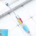 Kreativer mehrfarbiger Kugelschreiber mit langer Metallstange und klarem transparenten Gehäuse. - Süßigkeiten Blau