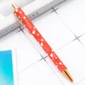 Stylo à bille en métal rouge avec motifs de cœur et finitions or rose pour le bureau. - Modèle Saint-Valentin C-Rouge