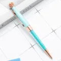 Light blue crown crystal ballpoint pen with rose gold accents and sparkling glitter sand. - Candy Blue