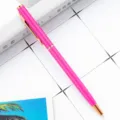 Metal ballpoint pen in bright pink with elegant rose gold trim for business office writing. - Rose Red