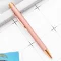 Stylo à bille en métal or rose élégant avec mécanisme à clic et écriture fluide. - Or rose