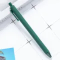 Dark green matte push ballpoint pen, stylish rubberized plastic stationery for school or office. - Dark Green