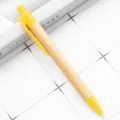 Eco-friendly bamboo ballpoint pen with yellow accents for office, school, and writing needs. - Yellow