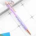 Elegant purple crystal ballpoint pen with clover charm and rose gold metallic accents. - Macaron Purple