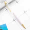 Stylo à bille en métal DIY élégant avec corps transparent et décor trèfle en strass rose. - Rose bonbon clair (éléments dorés)