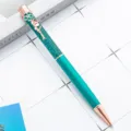 Elegant metal ballpoint pen with glitter body and flower clip, perfect office stationery. - Peacock Blue