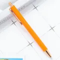 Oranje glinsterende balpen met roségouden accenten, elegant drukontwerp voor kantoor en school. - Geverfd Oranje