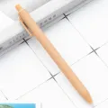 Minimalist retractable ballpoint pen with matte pastel beige finish, smooth writing stationery. - Tan