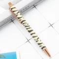 Retractable ballpoint pen with glitter zebra pattern and rose gold trim for office desk. - Light Yellow Zebra
