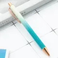 Verloop glitter balpen, stijlvolle metalen drukpen met roségouden accenten voor kantoor. - Verloop pauwblauw-geel