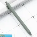 Minimalist matte green retractable ballpoint pen for smooth writing and student stationery. - Dark Green