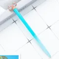 Cute crystal bow ballpoint pen with glittering blue barrel and rose gold accents. - Blue Gradient