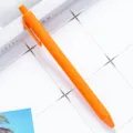 Orange click ballpoint pen, stylish candy color plastic stationery pen for smooth daily writing. - Orange