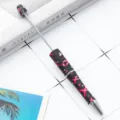 Stylish beaded ballpoint pen with chic pink ribbon pattern, smooth rotating design. - Pink Ribbon Butterfly Style