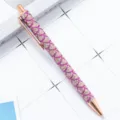 Retractable metal ballpoint pen with glitter mermaid pattern and rose gold accents for use. - Scale Pattern Rose Red