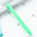 Mint green retractable ballpoint pen with matte rubberized finish for smooth daily writing. - Fluorescent Green