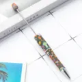DIY beaded ballpoint pen with floral patterned barrel and metal tip, smooth writing office stationery item. - Skull Floral Style
