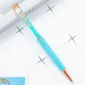 Blue crystal ballpoint pen with rose gold trim and floral clip, elegant office writing tool. - Light Blue