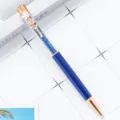 Luxury crystal ballpoint pen with elegant clover flower clip and sparkling blue rhinestones. - Transparent Blue