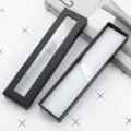Black paper gift pen box with clear window, elegant packaging for ballpoint and signature pens. - Black