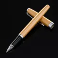 Metal business rollerball pen with a stylish gold barrel and silver clip for office use. - Champagne Gold