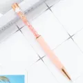 Elegant pink crystal ballpoint pen with four-leaf clover clip and sparkling rhinestones inside. - Pink