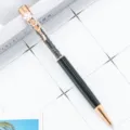 Rose gold crystal ballpoint pen with four-leaf clover clip and sparkly black stones. - Black