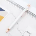 White metal retractable ballpoint pen with rose gold trim for office school and business. - White