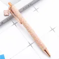 Rose gold glitter ballpoint pen with charming four-leaf clover pendant for elegant writing. - Sequin Rose Gold