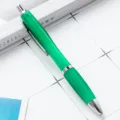 Green plastic retractable ballpoint pen with silver metal accents for office business use - Green
