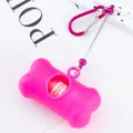Pink bone-shaped dog poop bag dispenser with metal clip, portable pet waste bag holder. - Rose Red